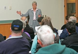 Mayor Suzette Cooke speaks with residents of the Mill Creek neighborhood about their concerns over a proposed apartment development during a neighborhood meeting Thursday at the Kent Senior Activity Center.