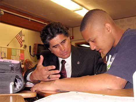 New Kent School District Superintendent Edward Lee Vargas helps a Meeker Middle School student with his school work earlier this month