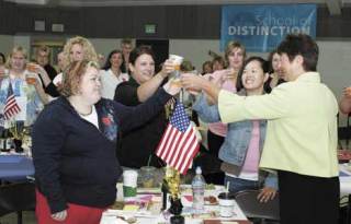 State Superintendent of Public Schools Terry Bergeson (far right) makes a toast Aug. 27 with (left to right) Tina DoRan