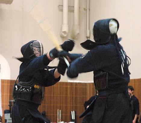 Two kendo competitors engage in battle Nov. 7