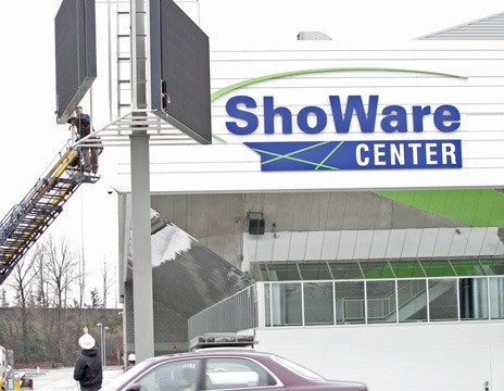 Crews from The Sign Factory of Kirkland install the video display board Thursday for the new marquee at the ShoWare Center in Kent. Arena officials expect to start using the display board Friday.