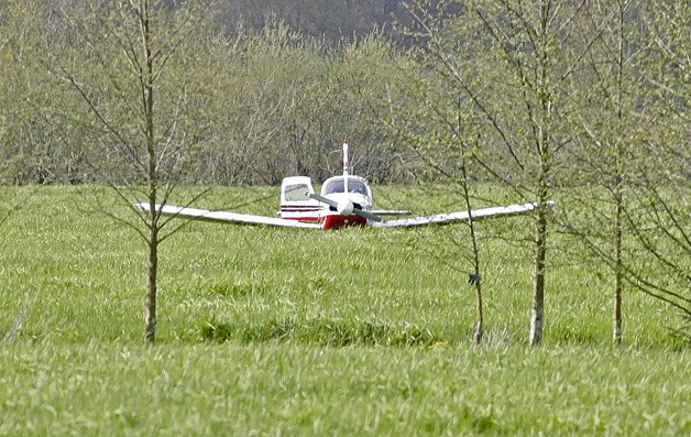A small plane lands safely near Smith Brothers Farms Wednesday