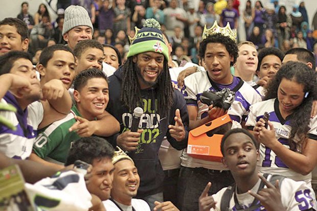 Seahawks cornerback Richard Sherman joined students at Foster High School for a homecoming pep rally last fall. Sherman talked to kids and judged a dance competition. His foundation also supplied new cleats for the football team and school supplies for kids.