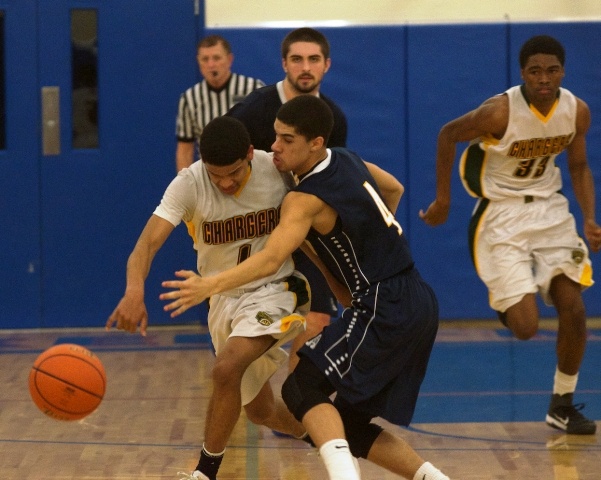 Kentridge's Deon Thomas tries to dribble up the court past Arlington's Donovan Sellgren during action Friday night. Thomas finished with seven points.