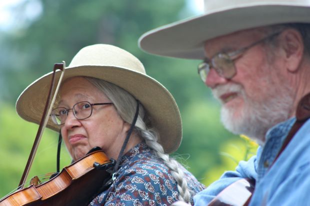 Vivian and Phil Williams of the Washington Old Time Fiddlers Association perform pioneer-day selections at Soos Creek Botanical Garden and Heritage Center on Saturday.