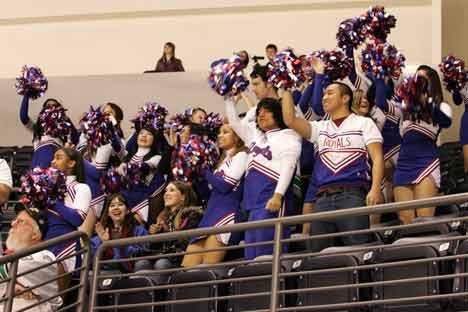 A Kent-Meridian High School cheering section gets in the spirit Jan. 7 during Kent-Meridian Night at the Seattle Thunderbirds hockey game.