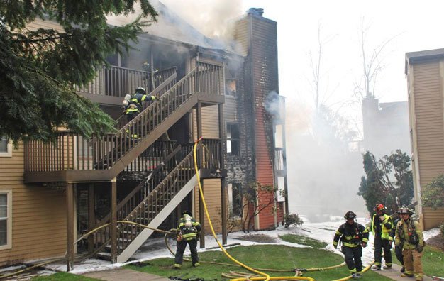 Firefighters attack a blaze Friday