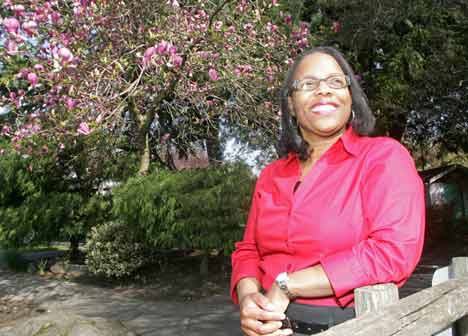 Patrice Gillum poses during her daily walk at Kaibara Park in Downtown Kent Tuesday.  Gillum was named 2009 city employee of the year. She  is the human resource analyst for the City of Kent.