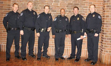 Mayor Suzette Cooke swore in five Kent Police officers at the Oct. 21 City Council meeting. From left to right are Andrew Grove
