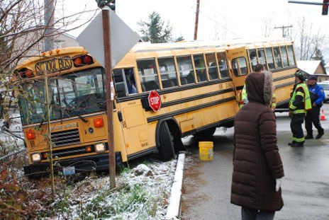 A Kent School District bus slid off the road Tuesday morning at the intersection of Southeast 270th Street and 124th Avenue Southeast. The bus carried 34 students. No one was injured.