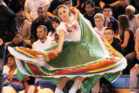 A Mexican dancer swirls her skirts during the Kent-Meridian High School multicultural assembly April 2 at the K-M gym.