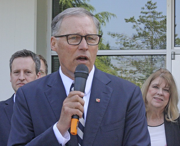Gov. Jay Inslee speaks at a press conference Thursday in Kent at the Oberto headquarters to promote adoption by the Legislature of a transportation package that would include funding to complete State Route 509 from SeaTac to Kent.
