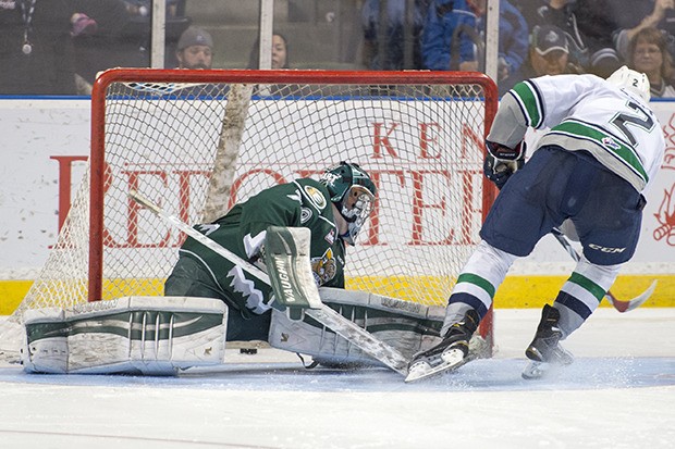 The Thunderbirds' Jerret Smith drills a goal past the Silvertips' Carter Hart in a seven-round shootout WHL win at the ShoWare Center.