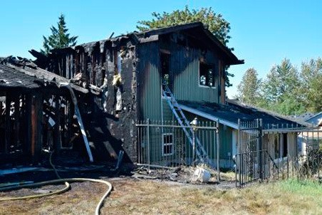 Fire burned an abandoned home Thursday in the 20900 block of 124th Avenue Southeast.
