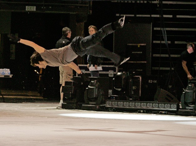 Figure skater Ryan Bradley performs an aerial flips as he rehearses his routine Wednesday
