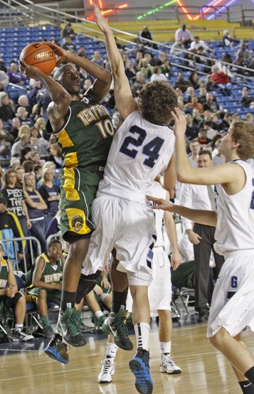 03/03/11 Kentridge's Gary Bell was tightly defended by Gonzaga Prep's Chris Sarbaugh during Thursday's Class 4A state basketball game. Bell scored 22 points in a 72-70 loss