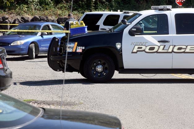 Kent Police investigate the shooting death of a man found Thursday morning outside of a blue car along East Saar Street