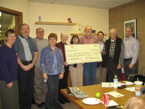 The Kent Sunrise Rotary Club presented Kent Youth and Family Services with a $10