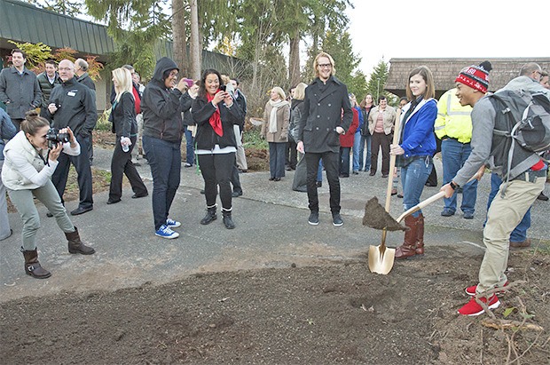 Green River Community College students and officials break ground at a ceremony to launch the construction of the school's new Student Life Center