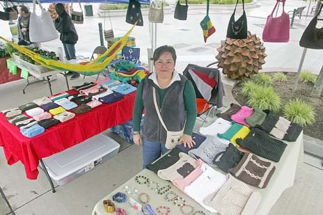 Vendor Maria Lopez sells her handmade purses at the Kent Farmers Market each Saturday.