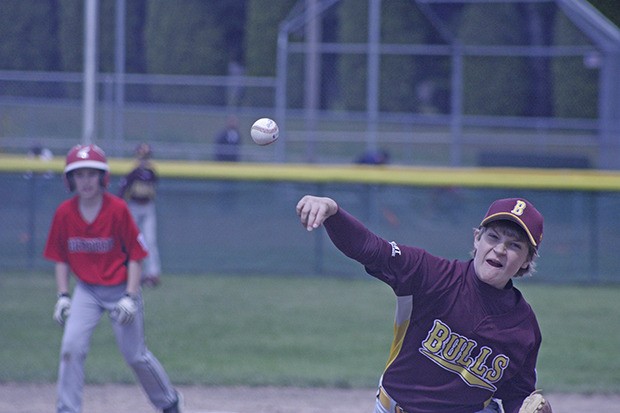 The Bulls’ Peter Dionne-Yahr unleashes a pitch against the Warriors in a Kent Little League Majors Division game at Ryan Brunner Baseball Fields last Saturday.