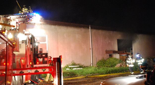 Kent firefighters battle a blaze Tuesday night at a commercial building in the 5800 block of South 228th Street.