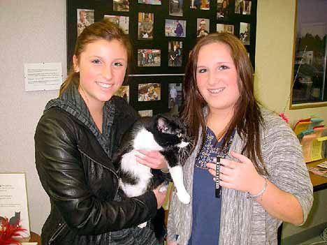 Sisters Ashley and Allysa Swanson went home with their new cat