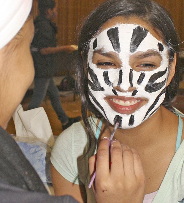 Joanna Jimenez gets her face painted by Jasmeen Kaur during the 25th annual Kent Kids’ Arts Day last year at Kent Commons. The Kent Parks