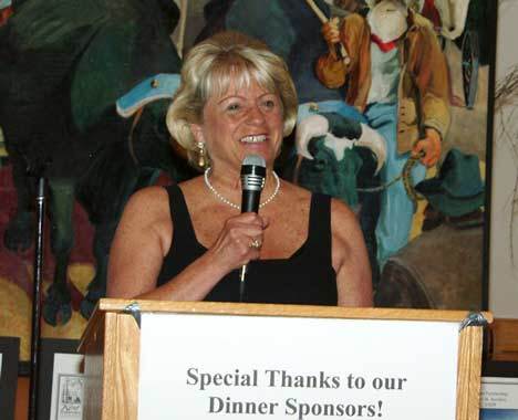 Jacquie Alexander addresses the crowd during the Kent Downtown Partnership’s annual auction June 20 at the Kent Senior Center.