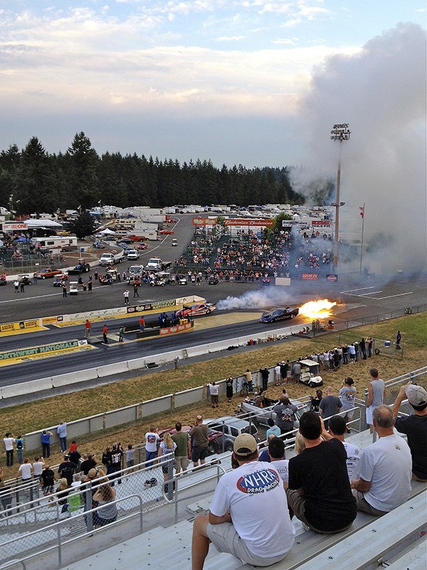Machinists Union members watch jet cars race during the 2012 Dog Days charity event