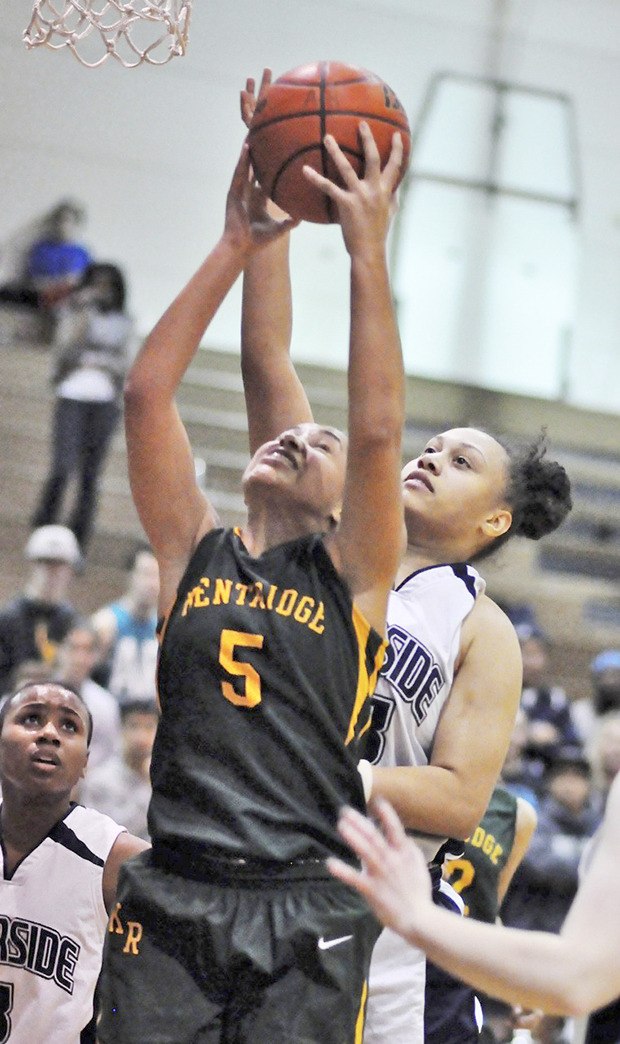 Fusing the Chargers: Kentridge’s Jazmin Caliman hits the glass against Auburn Riverside last week during a South Puget Sound League North Division game.