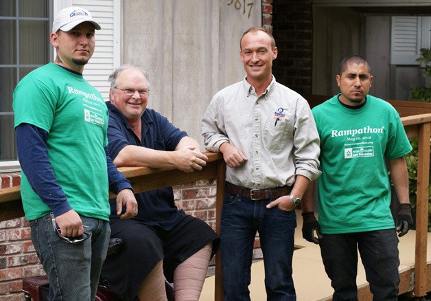 The volunteer crew from Powell Custom Homes and Renovations built a new wheelchair ramp for Steven Wangsness of Kent.