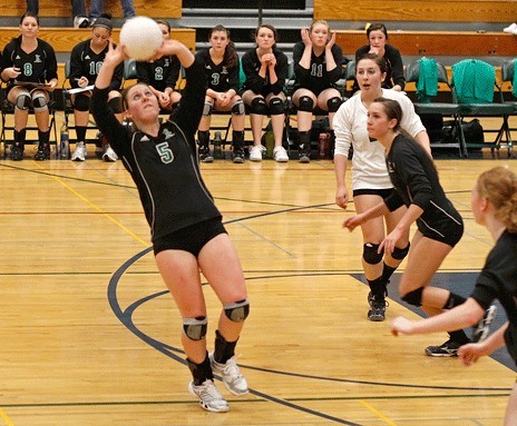 Kentwood junior Kacie Seims sets the ball to a teammate during a South Puget Sound League tournament match against Curtis on Saturday