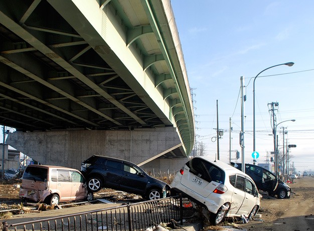 Cars pile up along a highway to Sendai