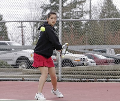 Kentlake’s Kara Ikeda has had to transform her tennis game this spring due to a shoulder injury