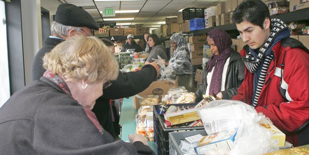 Volunteers hand out items at the Kent Food Bank.