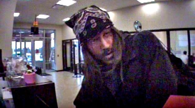 Kent Police are asking for help to identify this man in connection with a Feb. 12 bank robbery in the Panther Lake area.