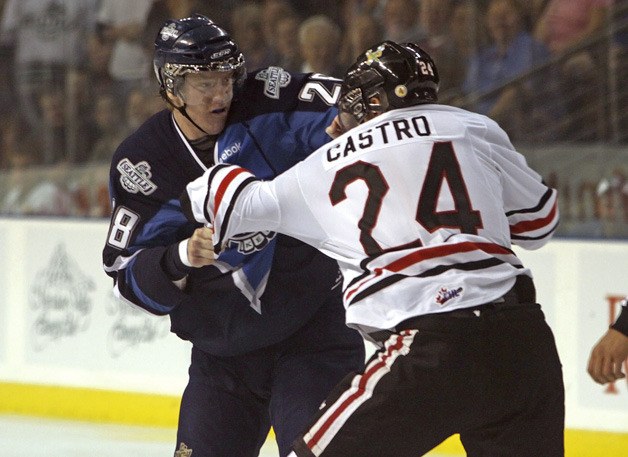 09/24/11 Seattle Thunderbirds' Jacob Doty gets in the first fight of the season with Winterhawks Cody Castro
