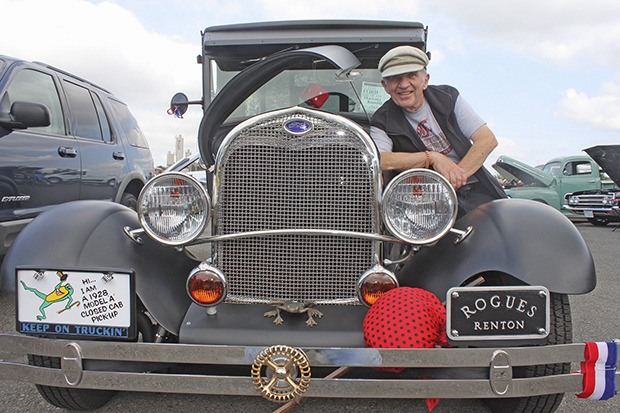 Renton's Mike Dire shows off his restored and customized 1928 Model A Ford pickup at the 27th annual All Ford and Mustang Roundup Car Show at Bowen Scarff Ford-Lincoln in Kent last Saturday.