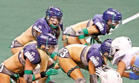 Seattle Mist's Lindsey Blaine looks to her right as she calls for a hike during the Mist's first game Sept. 11. The Mist were first to score and lead the whole game. They beat the Seduction 20-6 at ShoWare.
