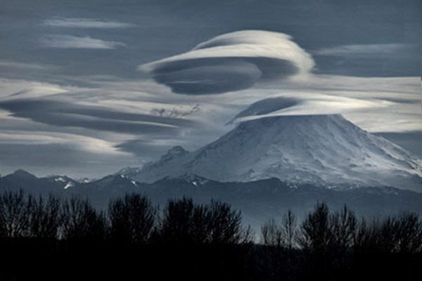 Kent resident Ernest Wead was on Kent's West Hill Tuesday and captured this mind-boggling view of Mount Rainier. 'I sat down and saw these clouds forming like halos around Mt. Rainer