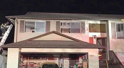 Kent firefighters extinguished a house fire in the 14500 block of Southeast 275 Place late Monday night. Two occupants got out safely.