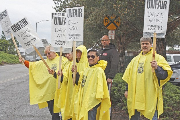Workers at the Davis Wire mill picket in front of the Kent plant on 80th Avenue South on Monday.