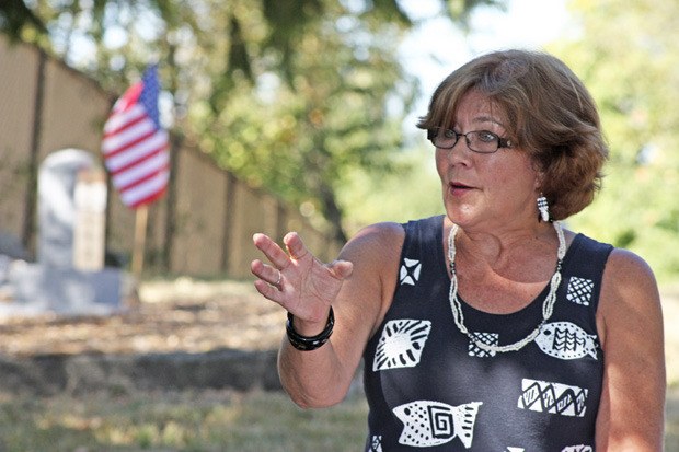 Mayor Suzette Cook addresses the gathering at last week's dedication ceremony at Saar Pioneer Cemetery. In the background