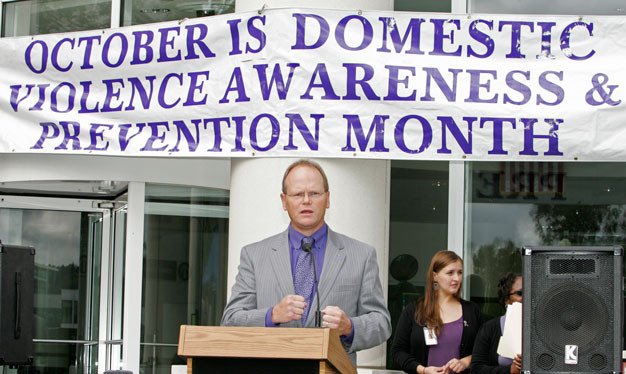 King County Prosecutor Dan Satterberg speaks at a previous domestic violence awareness rally in Kent. This year's rally is at noon Friday
