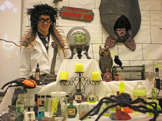 Pine Hill 5th grade teacher Jeiomie Heath poses with his mad scientist equipment for a special lab for his class.