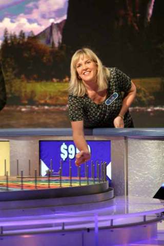 Lifelong Auburn-Kent resident Kimberlee Hole spins the wheel during a recent episode of Wheel of Fortune.