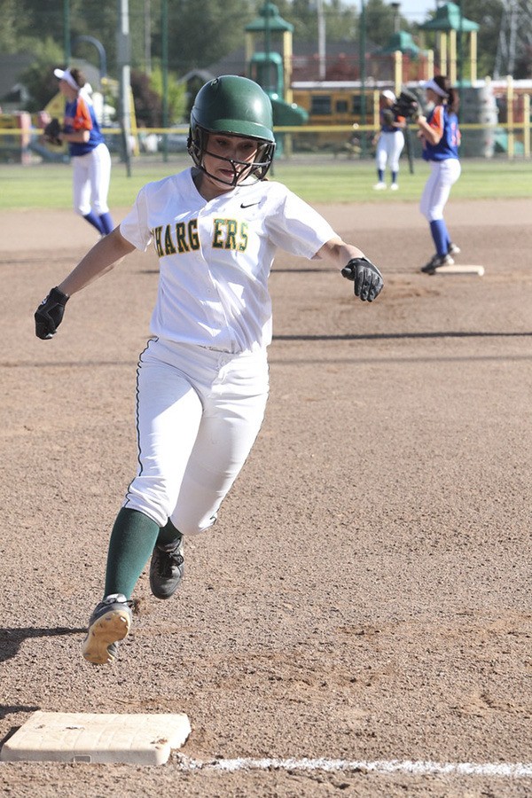 Kentridge High School senior Jessica Cruz rounds third base during a fastpitch game against Graham Kawpowsin on May 12 in the South Puget Sound League 4A tournament.