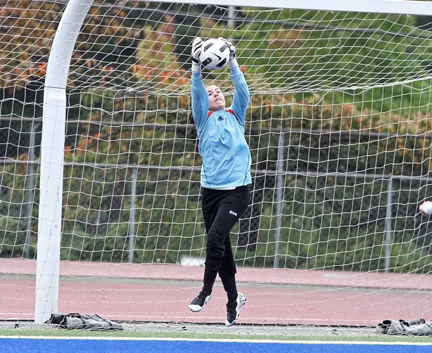 Kentlake goalkeeper Brittany Lydon makes a huge leap to stop a shot