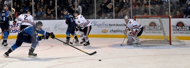 The Thunderbirds' Branden Troock reaches for the puck in the Portland zone.